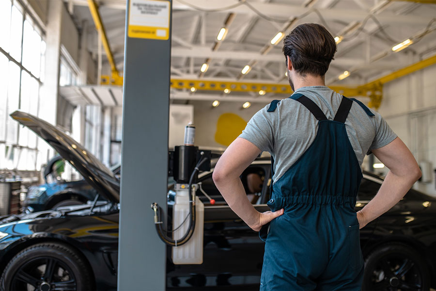 Technician ready to start service BMW car